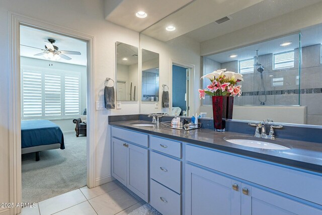 bathroom with vanity, tile patterned flooring, a wealth of natural light, and ceiling fan