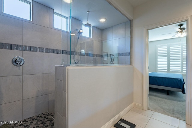 bathroom with a tile shower, tile patterned floors, and ceiling fan