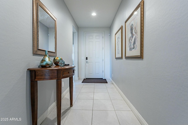 doorway featuring light tile patterned flooring