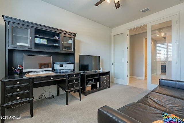 carpeted home office with lofted ceiling and ceiling fan