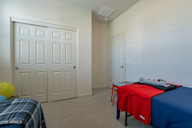 carpeted bedroom with a closet