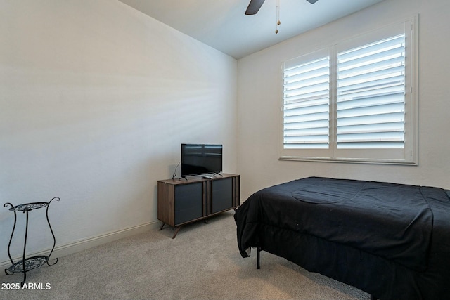 bedroom featuring ceiling fan, light colored carpet, and vaulted ceiling