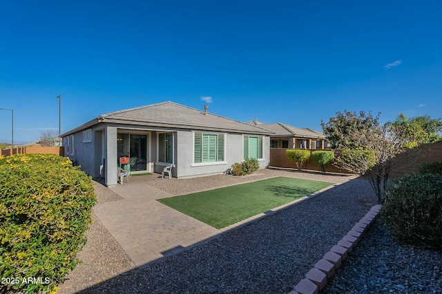 back of property featuring a patio area