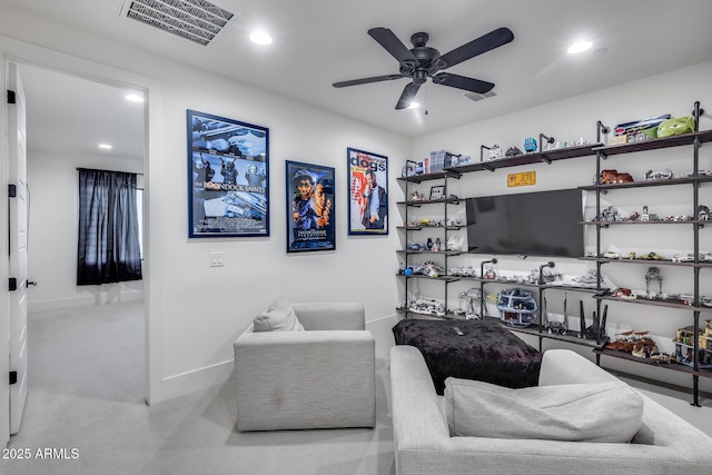 living room featuring light carpet and ceiling fan