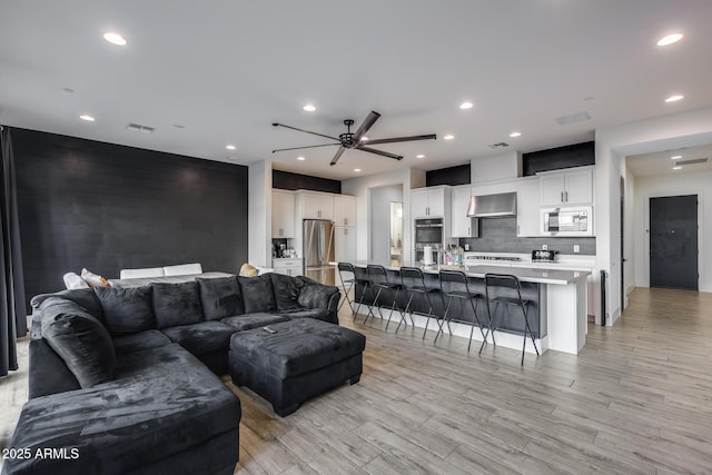 living room with ceiling fan