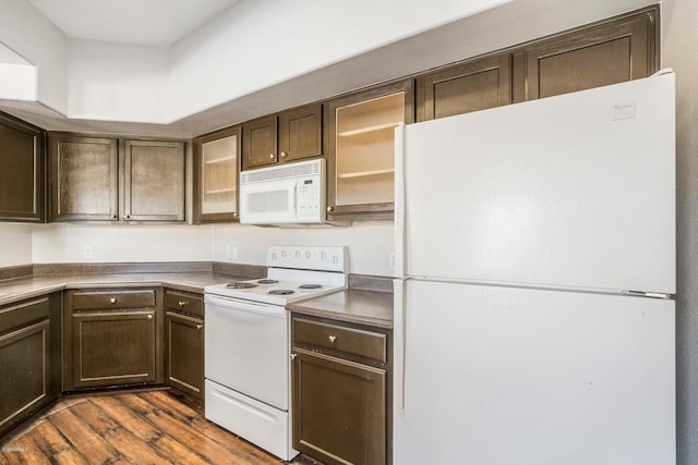 kitchen with dark wood-type flooring, white appliances, and dark brown cabinetry