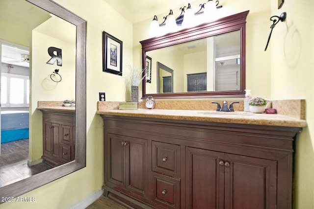 bathroom featuring ceiling fan and vanity