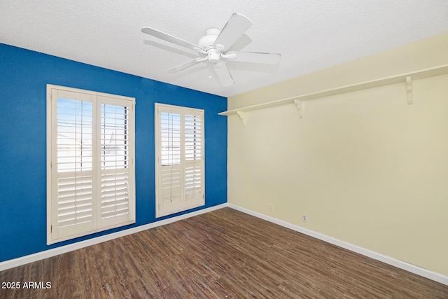 unfurnished room with ceiling fan, hardwood / wood-style flooring, and a textured ceiling