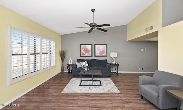 living room featuring lofted ceiling, dark wood-type flooring, and ceiling fan