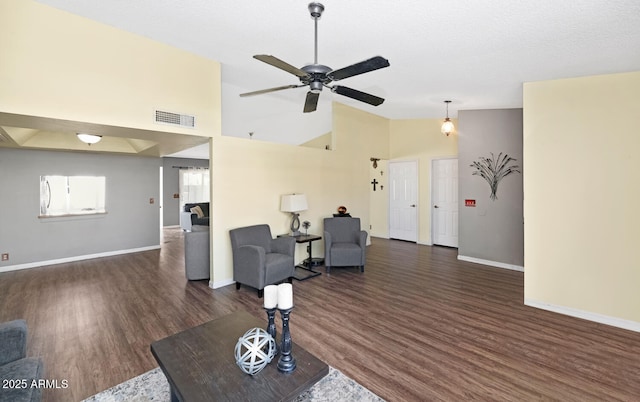 living room with high vaulted ceiling, dark hardwood / wood-style floors, and ceiling fan