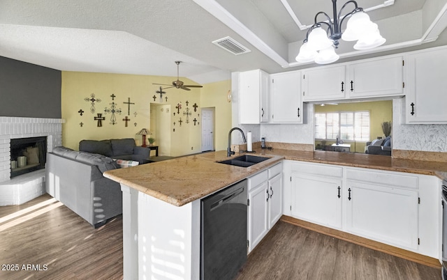 kitchen with white cabinets, sink, kitchen peninsula, and black dishwasher