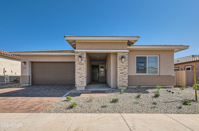 870 W Peralta Pass, Apache Junction, AZ 85120 - prairie-style house with stucco siding, decorative driveway, a garage, and stone siding