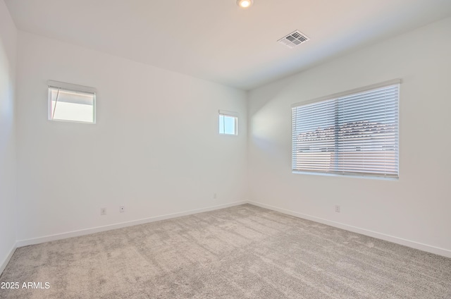 870 W Peralta Pass, Apache Junction, AZ 85120 - carpeted empty room featuring healthy amount of natural light and baseboards