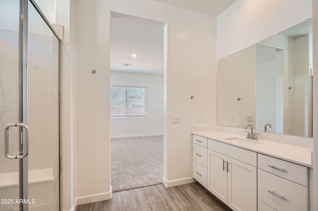 870 W Peralta Pass, Apache Junction, AZ 85120 - full bathroom featuring vanity, a shower stall, wood finished floors, and baseboards