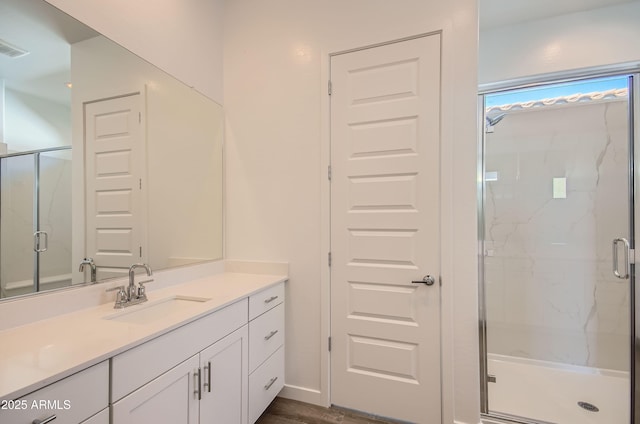 870 W Peralta Pass, Apache Junction, AZ 85120 - bathroom featuring vanity, a marble finish shower, and wood finished floors