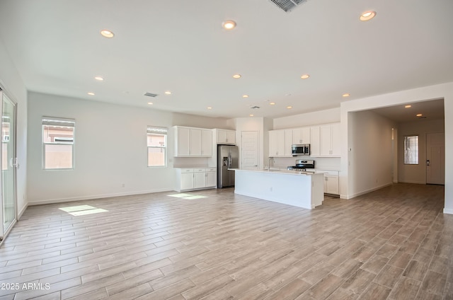 870 W Peralta Pass, Apache Junction, AZ 85120 - kitchen featuring stainless steel appliances, open floor plan, a sink, white cabinets, and an island with sink