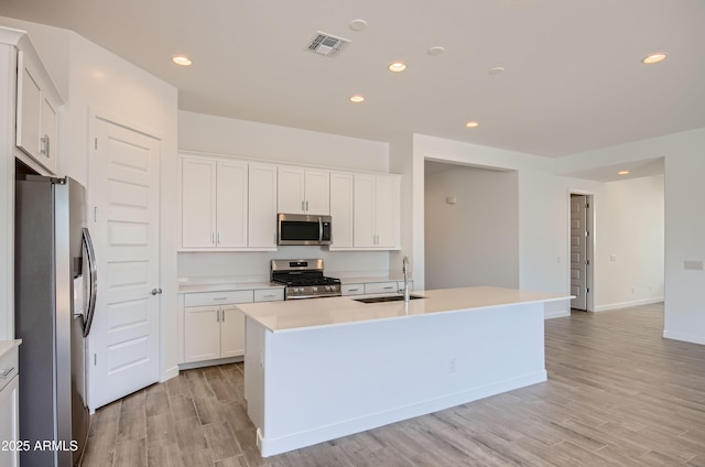 870 W Peralta Pass, Apache Junction, AZ 85120 - kitchen with appliances with stainless steel finishes, a sink, recessed lighting, light countertops, and white cabinets