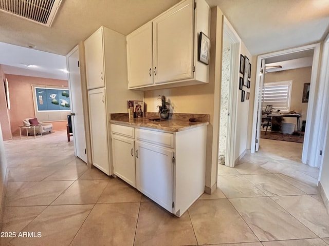 interior space featuring light tile patterned flooring