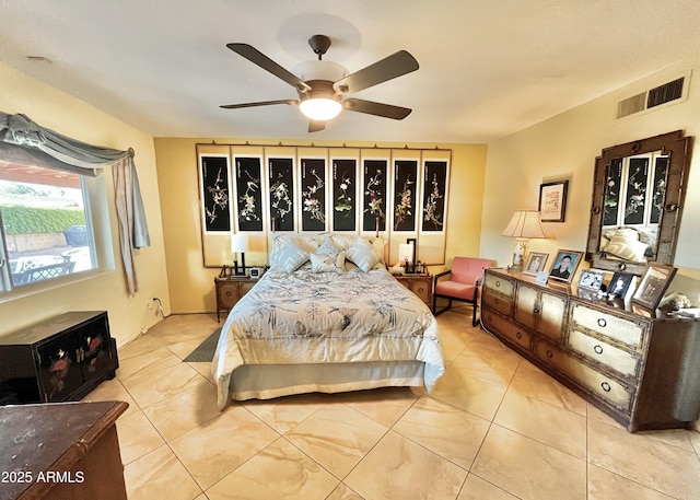 tiled bedroom with ceiling fan