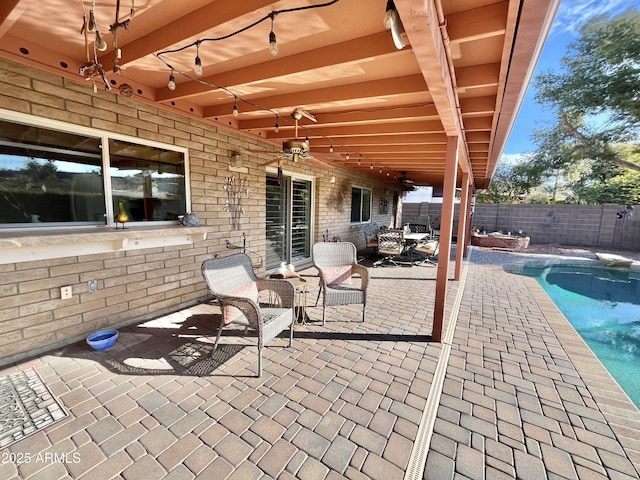 view of patio with a fenced in pool