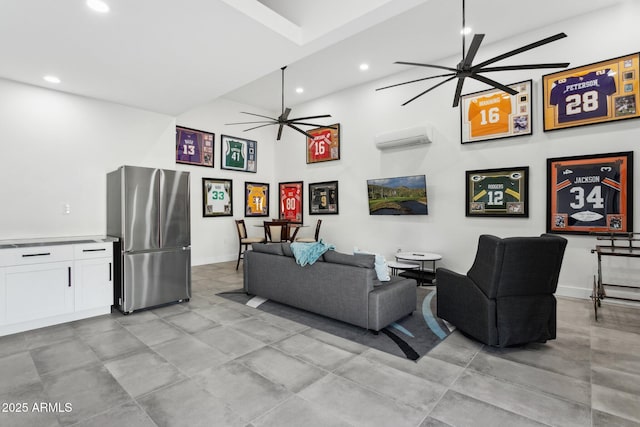 living room with an AC wall unit, recessed lighting, and ceiling fan