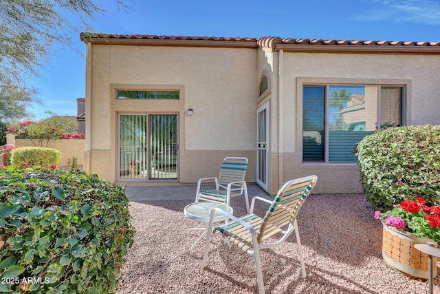 back of property featuring a patio area