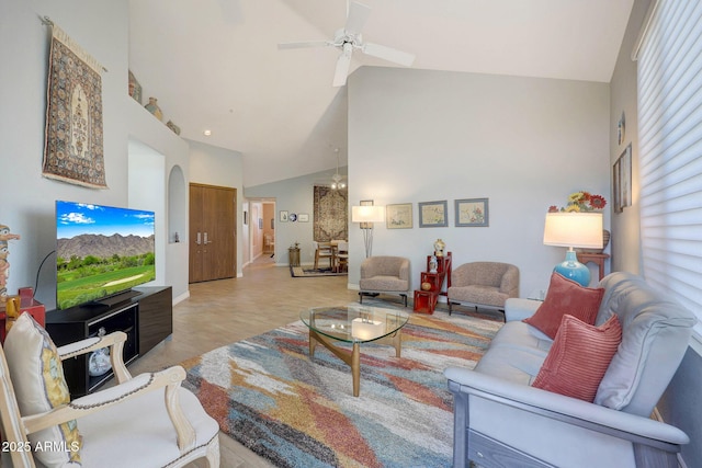 living room featuring high vaulted ceiling and ceiling fan