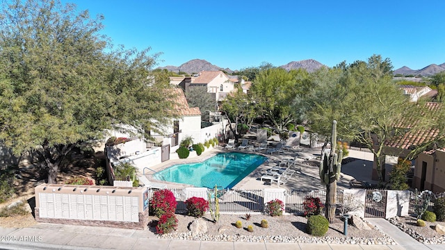 view of pool featuring a mountain view and a patio