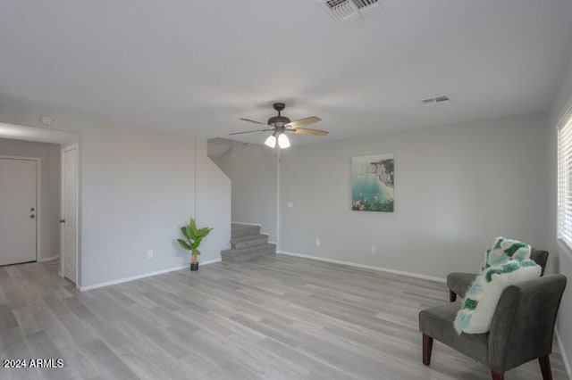 unfurnished room featuring light hardwood / wood-style floors and ceiling fan