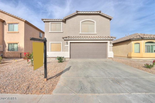 mediterranean / spanish-style house featuring a garage