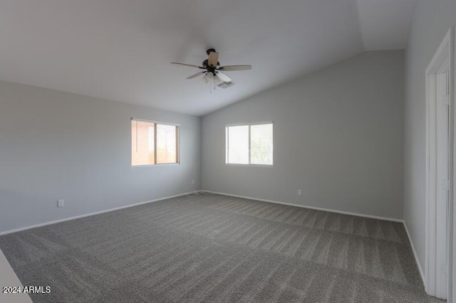 carpeted empty room featuring ceiling fan and lofted ceiling