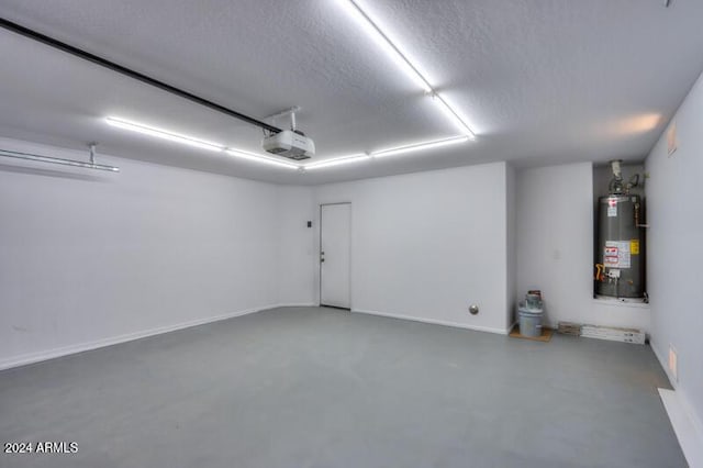 garage featuring a garage door opener and gas water heater