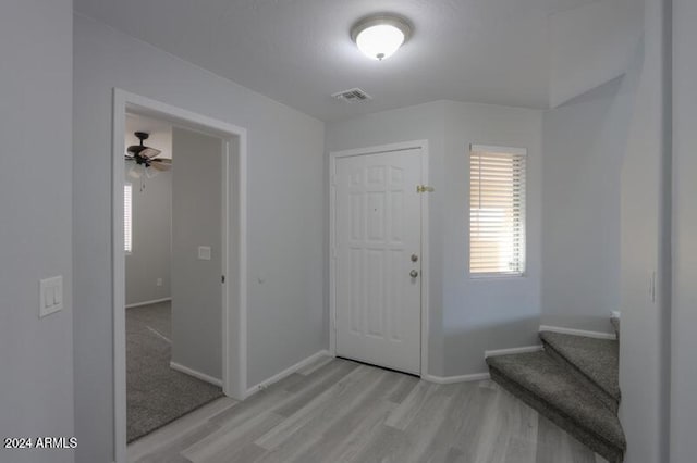 foyer featuring ceiling fan and light wood-type flooring