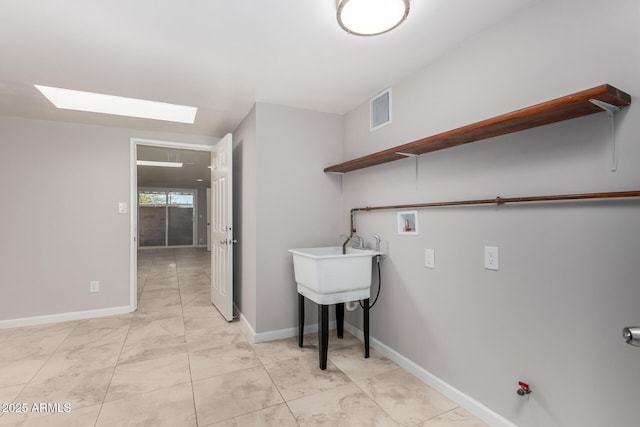 washroom with washer hookup, marble finish floor, visible vents, laundry area, and baseboards