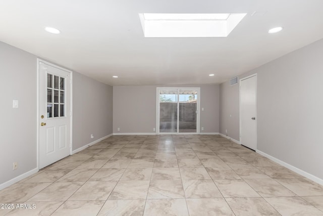 unfurnished room with recessed lighting, visible vents, and baseboards