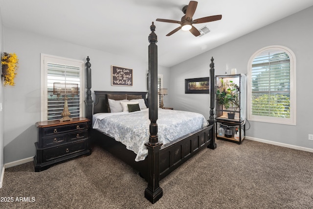 bedroom with lofted ceiling, dark carpet, and ceiling fan