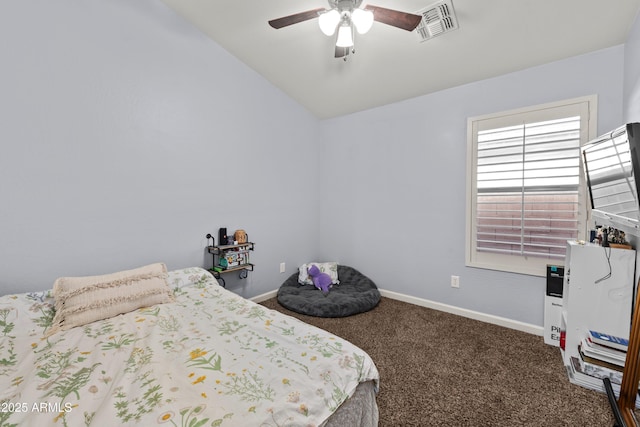 bedroom with lofted ceiling, ceiling fan, and dark colored carpet