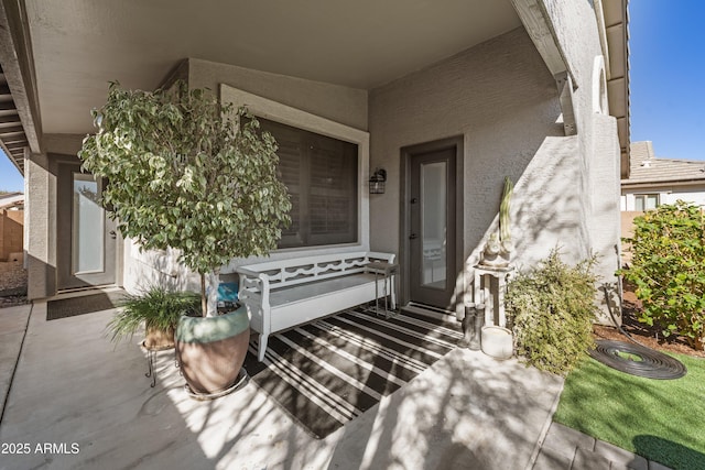 property entrance with a patio