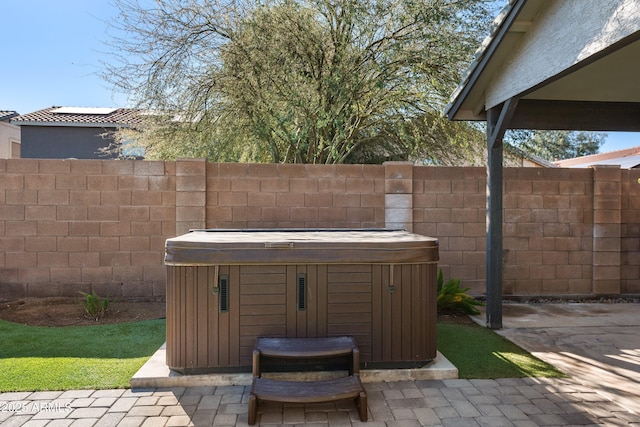 view of patio with a hot tub