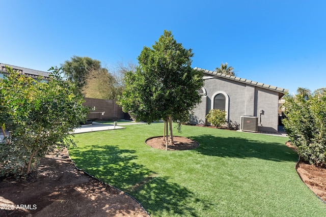 view of yard featuring central AC