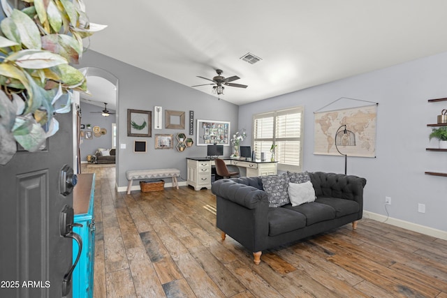 living room with ceiling fan, lofted ceiling, and wood-type flooring