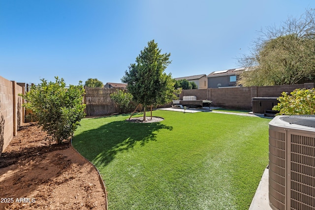 view of yard featuring cooling unit and a patio area