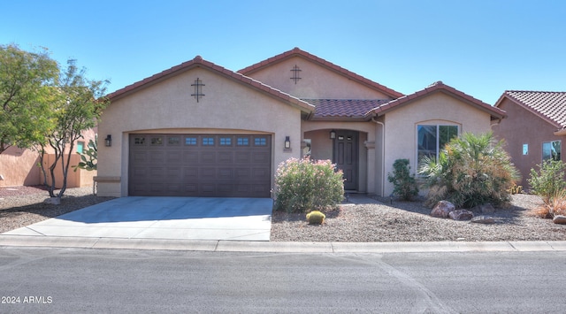 view of front of property with a garage