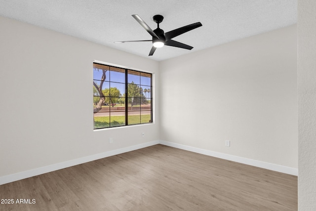 609 E Mesquite Cir Unit D132, Tempe, AZ 85288 - empty room with wood finished floors, a ceiling fan, and a textured ceiling