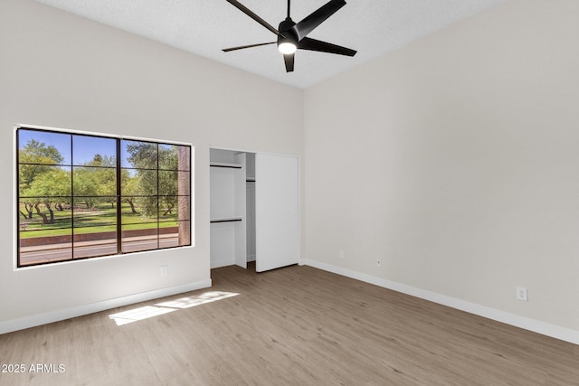 609 E Mesquite Cir Unit D132, Tempe, AZ 85288 - unfurnished bedroom featuring wood finished floors, high vaulted ceiling, and ceiling fan