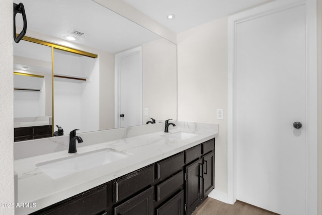 609 E Mesquite Cir Unit D132, Tempe, AZ 85288 - bathroom featuring double vanity, wood finished floors, and recessed lighting