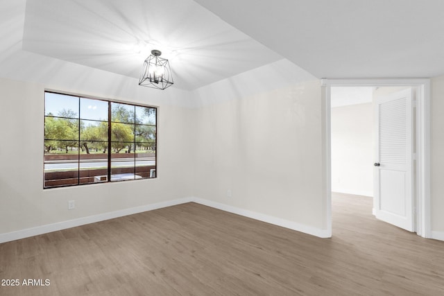 609 E Mesquite Cir Unit D132, Tempe, AZ 85288 - spare room featuring wood finished floors and a chandelier