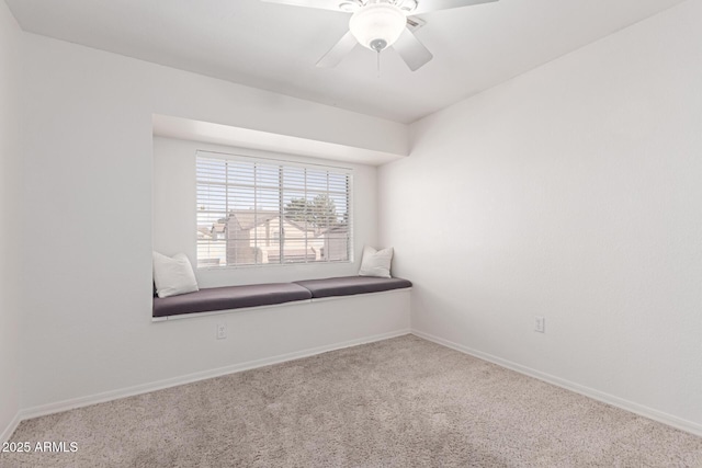 empty room with baseboards, carpet floors, and ceiling fan