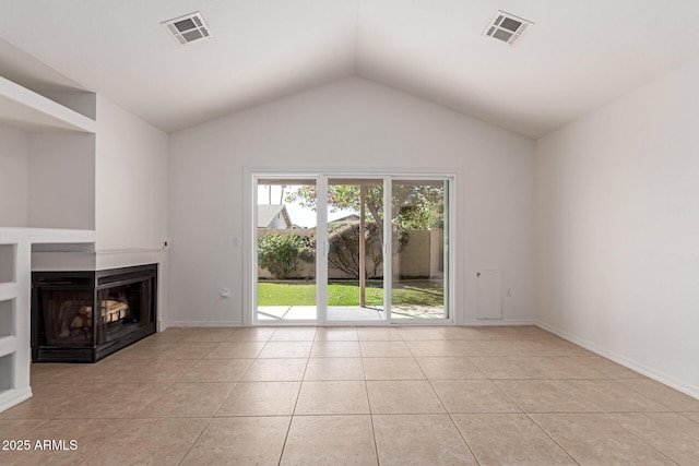 unfurnished living room featuring vaulted ceiling, light tile patterned floors, visible vents, and a multi sided fireplace