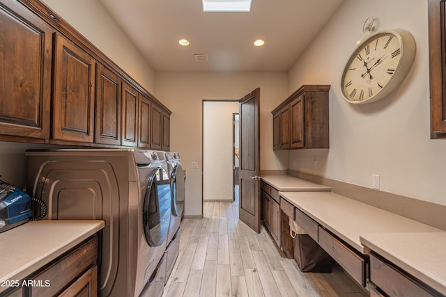 14332 E Bobwhite Way, Scottsdale, AZ 85262 - washroom with cabinet space, washing machine and clothes dryer, recessed lighting, and light wood finished floors